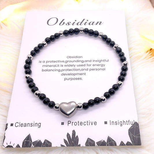 Steinfixx® - Obsidian Perlenarmband mit Edelstahlherz und Edelstahlperlen - Hochwertiges Edelsteinarmband handgefertigt inclusive edler Geschenkbox und Edelsteinkarte